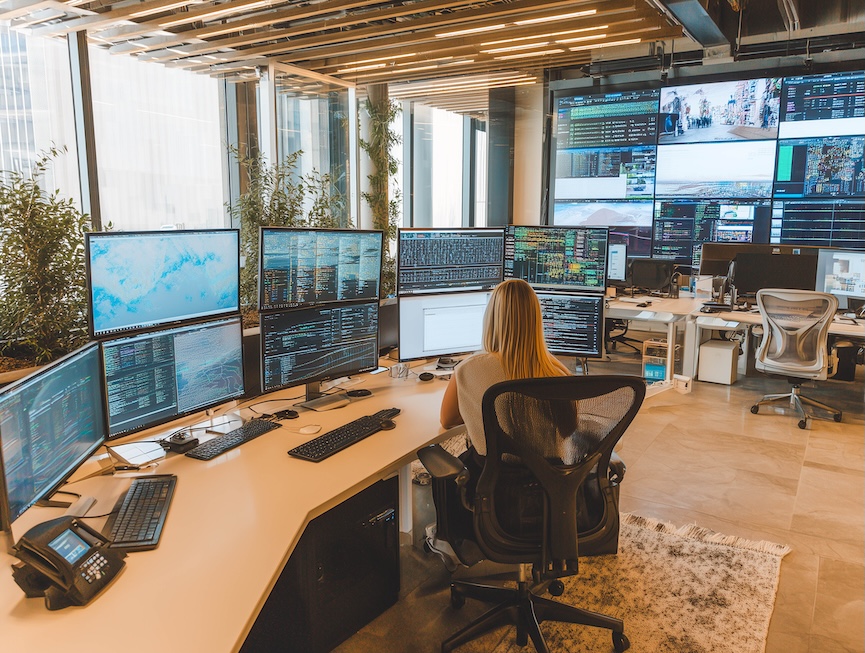 Woman at multiple screens