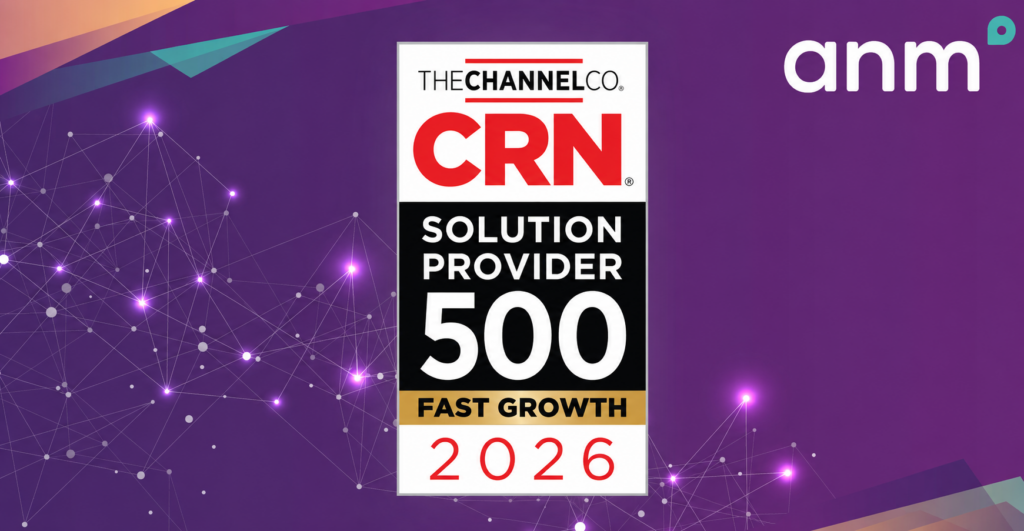 IT professional with laptop standing in server data center - Data Center & Cloud CRN Solution Provider 500 Fast Growth 2026 Logo